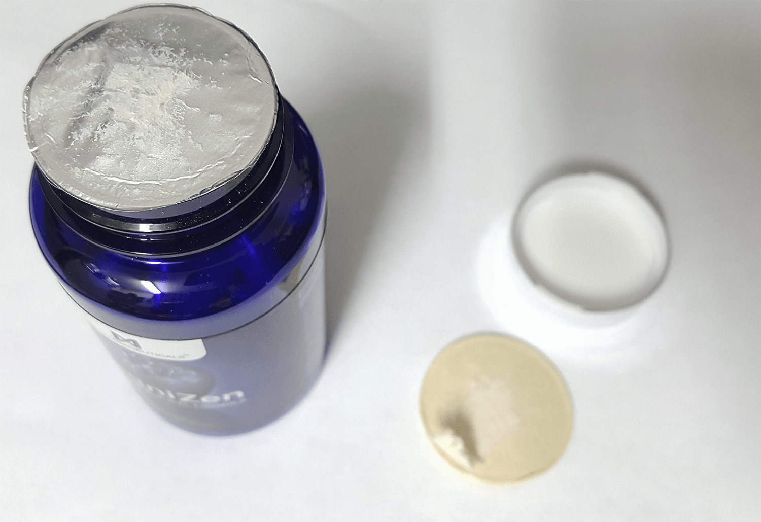 KogniZen bottle opening seal showing damage
